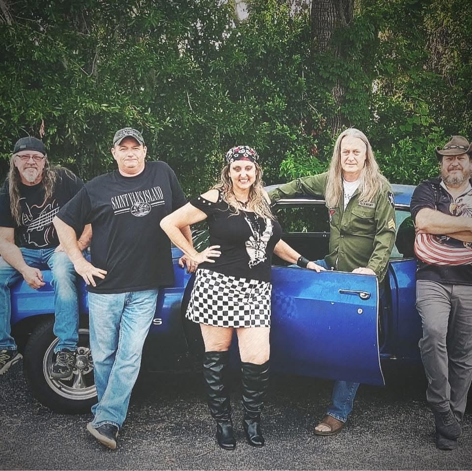 Late 4 Class Band performing live in North Florida with guitars, drums, and energetic stage lighting during a crowd-pumping show.